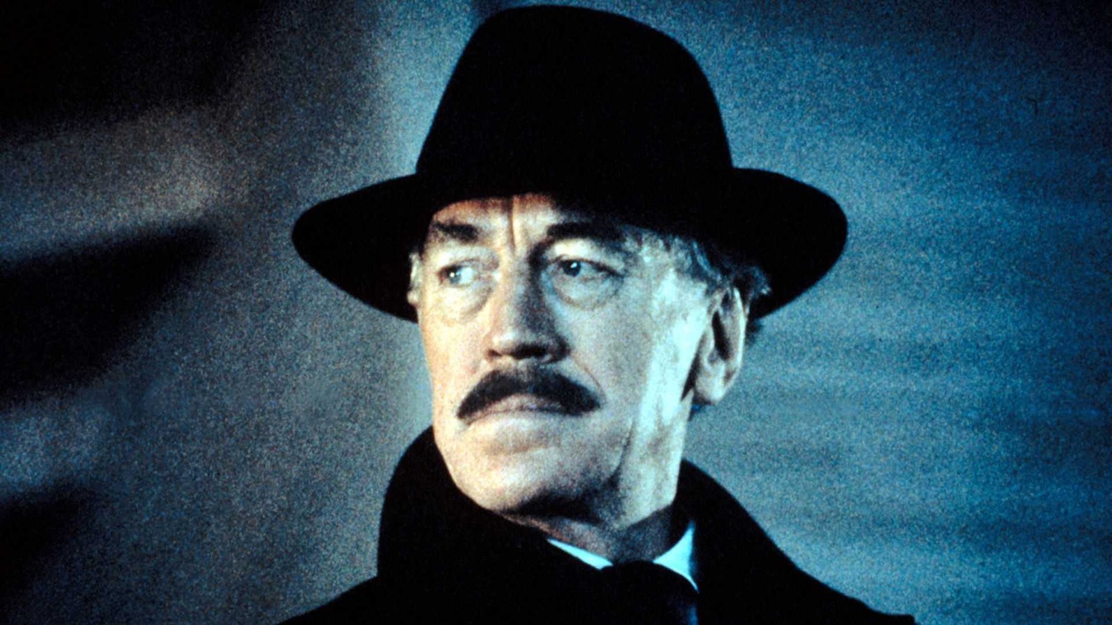 Leland Gaunt (Max von Sydow) looking over his shoulder in Needful Things.